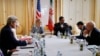 U.S. Secretary of State John Kerry, at left, Iranian Foreign Minister Mohammad Javad Zarif, at right, meets at a hotel in Vienna, June 27, 2015. 