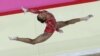 US gymnast Gabrielle Douglas performs on the balance beam during the Artistic Gymnastic women's team final at the 2012 Summer Olympics in London, July 31, 2012.