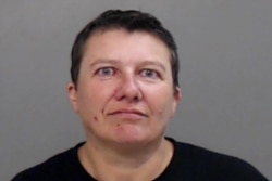 FILE - Pascale Ferrier appears in a jail booking photograph taken after her arrest by the Mission Police Department in Mission, Texas, March 13, 2019.
