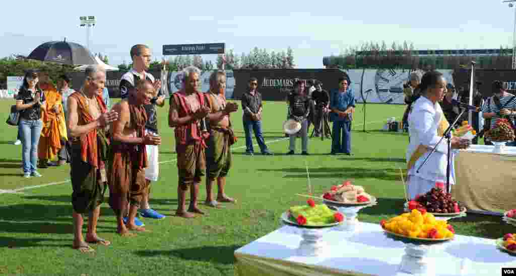 A prayer ceremony opens the elephant polo match. Director Tim Boda is flanked by Thailand's last remaining Kru Ba Yai (elephant spirit men), 2014 King's Cup Elephant Polo Tournament in Samut Prakan province, on the outskirts of Bangkok, Aug. 28,