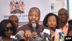FILE - Kenya's Health Minister Mutahi Kagwe (C) speaks at Mbagathi Hospital during the launch of an isolation and treatment center for coronavirus patients, in Nairobi, Kenya, March 6, 2020.
