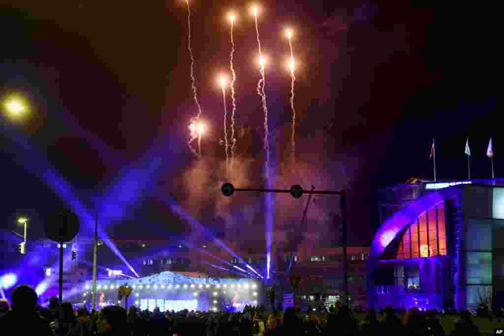 Fireworks light up the sky as the centenary year of Finnish independence kicks off on New Year's Eve, Dec. 31, 2016, with a big concert and dancing, in Helsinki, Finland.