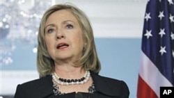 Secretary of State Hillary Rodham Clinton gestures while speaking at the State Department in Washington, DC, April 20, 2011