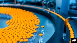 FILE - This October 22, 2021 photo provided by Pfizer shows kid-size doses of its COVID-19 vaccine in Puurs, Belgium.