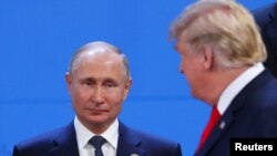 U.S. President Donald Trump and Russia's President Vladimir Putin are seen during the G20 leaders summit in Buenos Aires, Argentina Nov. 30, 2018. 