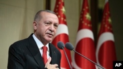 FILE - Turkish President Recep Tayyip Erdogan speaks during a reception on Republic Day, in Ankara, Turkey, Oct. 29, 2019. 