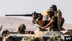 FILE - Turkish soldiers sit on a tank driving to Syria from the Turkish Syrian border city of Karkamis in the southern region of Gaziantep, Aug. 27, 2016. Part of Ankara's mission is to diminish the growing influence of Syrian Kurds in the region.