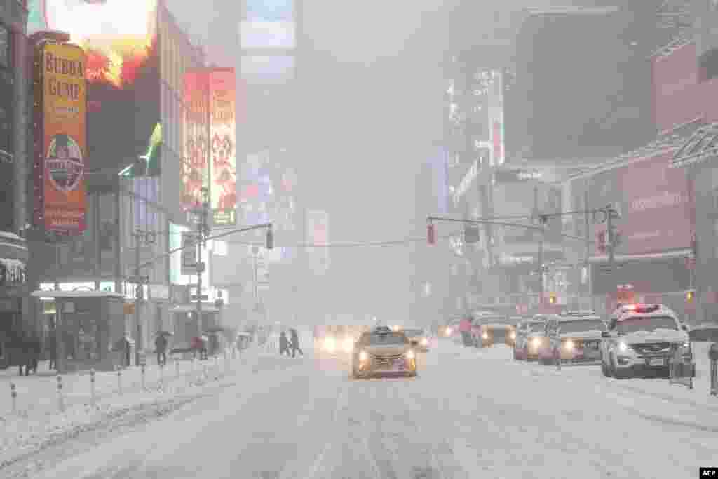 A general View of Times Square while snow falls on January 23, 2016 in New York.