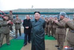North Korean leader Kim Jong Un oversees a super-large multiple launch rocket system test in this undated picture released by North Korea's Central News Agency, Nov. 28, 2019.