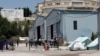 Closure Plans for Notorious Greek Camp Spark Hopes and Fears