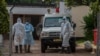 FILE - Medical workers are seen outside the COVID-19 treatment center at Kamuzu Central Hospital in Lilongwe, Malawi, Jan. 18, 2021. Teachers in the country went on strike Feb. 22, 2021, demanding adequate safety equipment and better pay. (L. Masina/VOA)
