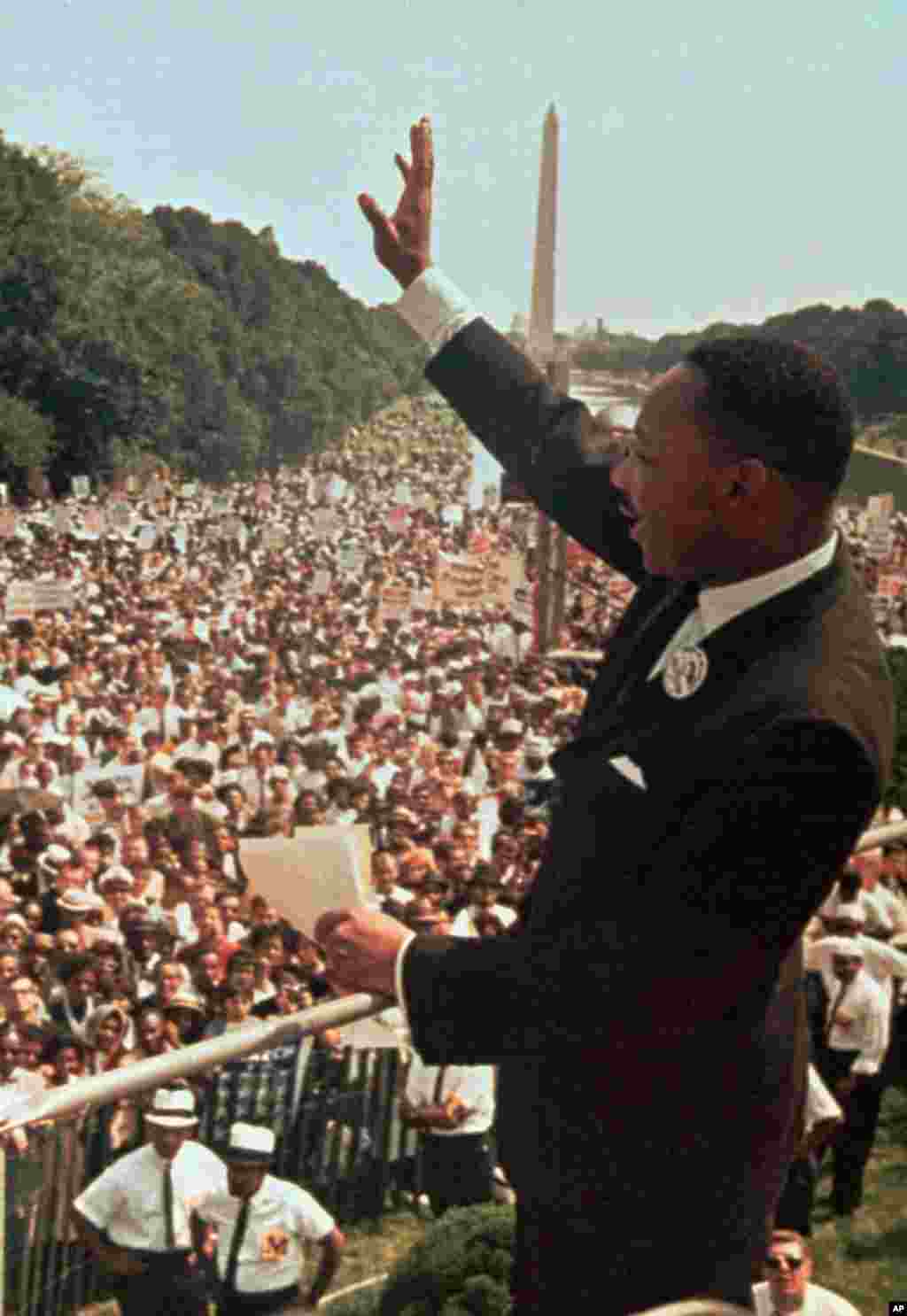 Martin Luther King, Jr. acknowledges the crowd at the Lincoln Memorial for his "I Have a Dream" speech during the March on Washington, August 28, 1963.