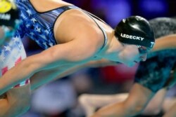 FILE - Katie Ledecky participates in the women's 800-meter freestyle during wave 2 of the U.S. Olympic Swim Trials, June 19, 2021, in Omaha, Neb.