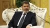 Egypt's President Mohammed Morsi meets with Chinese Vice President Xi Jinping, unseen, at the Great Hall of the People in Beijing, August 29, 2012. 