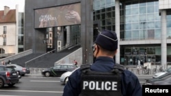 FILE - A French police stands near the Opera Bastille where a suspect in a stabbing attack near the former offices of the magazine Charlie Hebdo has been arrested in Paris, France, Sept. 25, 2020.
