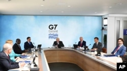 Britain's Prime Minister Boris Johnson, center, and other Group of Seven leaders are pictured at their summit in Cornwall, England, June 12, 2021.