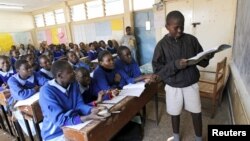 Pupils revise their class work without a teacher on the second week of a national teachers' strike, at Olympic Primary School in Kenya's capital Nairobi, September 9, 2015.