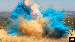 FILE - This April 23, 2017, photo from video provided by the U.S. Forest Service shows a gender reveal event in the Santa Rita Mountain's foothills, southeast of Tucson, Ariz. The explosion from the reveal ignited the 47,000-acre Sawmill Fire.