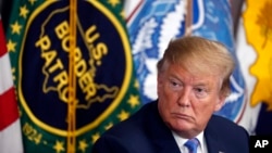 FILE - President Donald Trump participates in a roundtable on immigration and border security at the U.S. Border Patrol Calexico Station in Calexico, California, April 5, 2019. He wants to give automatic green cards to foreign students who graduate from U.S. colleges.