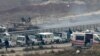 Aleppo Evacuation Suspended; Putin Calls for New Round of Talks