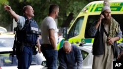 FILE - Police outside a mosque in Christchurch, New Zealand, March 15, 2019, following a shooting. An inquiry that began Oct. 24, 2023, will examine the response times of police and medics and whether any of the 51 people who were killed could have been saved.