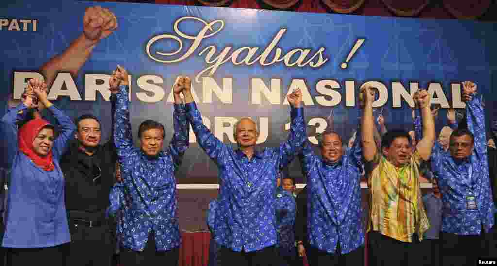 Malaysia's Prime Minister Najib Razak celebrates after winning elections at his party headquarters in Kuala Lumpur, Malaysia, early May 6, 2013.