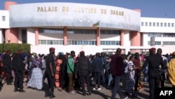 FILE - People queue to enter the Court in Dakar on Dec. 14, 2017, to attend the trial of Dakar's popular mayor Khalifa Sall and four of his associates on charges of embezzling public funds. 