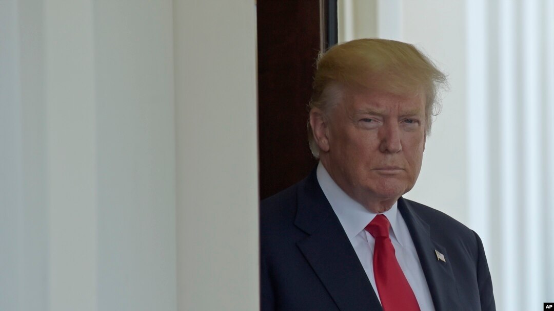 FILE - President Donald Trump is seen at the White House. Trump caused an uproar at home and abroad by retweeting anti-Muslim videos posted on Twitter by a far-right British politician.