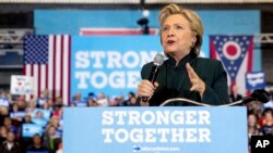 Campaign 2016 Black Activists Clinton: FILE - In this Friday, Oct. 21, 2016, file photo, Democratic presidential candidate Hillary Clinton speaks at a rally at Cuyahoga Community College in Cleveland. Some young black activists who had their doubts about Hillary Clinton are coming around to support her - some enthusiastically, some because they cannot stand Donald Trump. African-American voters are seen as key to Clinton's path to victory in November.