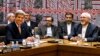 U.S. Secretary of State John Kerry, left, and Iranian Foreign Minister Mohammad Javad Zarif attend a meeting of the five permanent members of the Security Council plus Germany, Sept. 26, 2013.