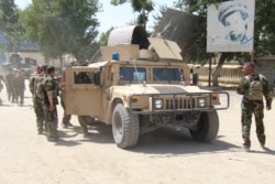 FILE - Afghan commando forces are seen at the site of a battlefield where they clashed with Taliban insurgents in Kunduz province, Afghanistan June 22, 2021.