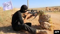 A rebel fighter from the "First Battalion" under the Free Syrian Army takes part in a military training on June 10, 2015, in the rebel-held countryside of the northern city of Aleppo. 