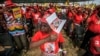 Supporters of Mozambican Liberation Front (FRELIMO) presidential candidate Filipe Nyusi cheer during the final FRELIMO campaign rally on the outskirts of Maputo, Oct.12, 2014.