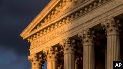 FILE - In this Oct. 10, 2017, file photo, the U.S. Supreme Court in Washington is seen at sunset. 