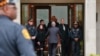 Pittsburgh police stand guard as the casket of Irving Younger, 69, is wheeled from Congregation Rodef Shalom after his funeral in Pittsburgh, Oct. 31, 2018. 
