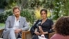 El príncipe Enrique de Gran Bretaña y su esposa Meghan Markle durante una entrevista de la presentadora estadounidense Oprah Winfrey.