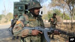 Indian army soldiers patrol during a search operation outside the camp of the General Engineering Reserve Force (GREF), the site of a militant attack, in the frontier Battal area, about 90 kilometers from Jammu, India, Jan. 9, 2017.