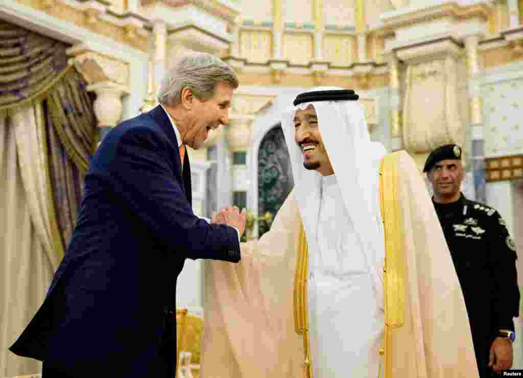 U.S. Secretary of State John Kerry shakes hands with Saudi Arabia's King Salman at the Royal Court, in Riyadh, May 7, 2015.