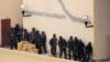 Kenya Defence Forces soldiers comb the rooftop of the Westgate shopping mall, on the fourth day since militants stormed into the mall, in Nairobi on September 24, 2013.