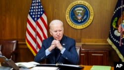 This image provided by The White House via Twitter shows President Joe Biden at Camp David, Md., Feb. 12, 2022.