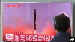 FILE - A man watches a TV screen showing a file footage of North Korea's missile launch at the Seoul Railway Station in Seoul, South Korea, Aug. 29, 2017. 