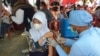 Ilustrasi - Pelaksanaan Vaksinasi anak usia 6-11 tahun yang dilaksanakan di Sekolah Dasar Negeri Inpres 7 Poso, Kabupaten Poso, Sulawesi Tengah, 19 Januari 2022 (Foto: VOA/Yoanes Litha) 