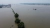 An aerial view shows the swollen Yangtze River in Jiujiang, in China's central Jiangxi province, on July 17, 2020.