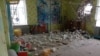 This handout photograph taken and released Feb. 17, 2022, by the Ukrainian Joint Forces Operation press service, shows debris after the reported shelling of a kindergarten in the town of Stanytsia Luhanska, Luhansk region, Ukraine.