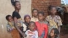 FILE - Neema, a DRC refugee says in the absence of WFP food aid she feels her family of 8 children is buried alive. (Lameck Masina/VOA)