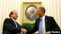 FILE - President Barack Obama shakes hands with Pakistan's Prime Minister Nawaz Sharif in the Oval Office at the White House in Washington, Oct. 23, 2013.