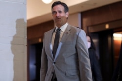FILE - Director of National Intelligence John Ratcliffe arrives to brief congressional leaders, on Capitol Hill in Washington, July 2, 2020.
