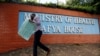 FILE - A Kenyan talks on his mobile phone outside the Ministry of Health headquarters in Nairobi, Kenya, Dec. 8, 2016. On Nov. 21 and 22, 2019, Kenya held its first mental health conference, steered by its Ministry of Health.