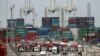 Cargo trucks wait in line at the Port of Long Beach, in Long Beach, California, Feb. 17, 2015.