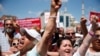 FILE - Supporters of Turkey's Republican People's Party protest outside a court in Istanbul, where CHP Istanbul provincial chairwoman Canan Kaftancioglu appeared, July 18, 2019. Kaftancioglu is standing trial for tweets she posted on social media.